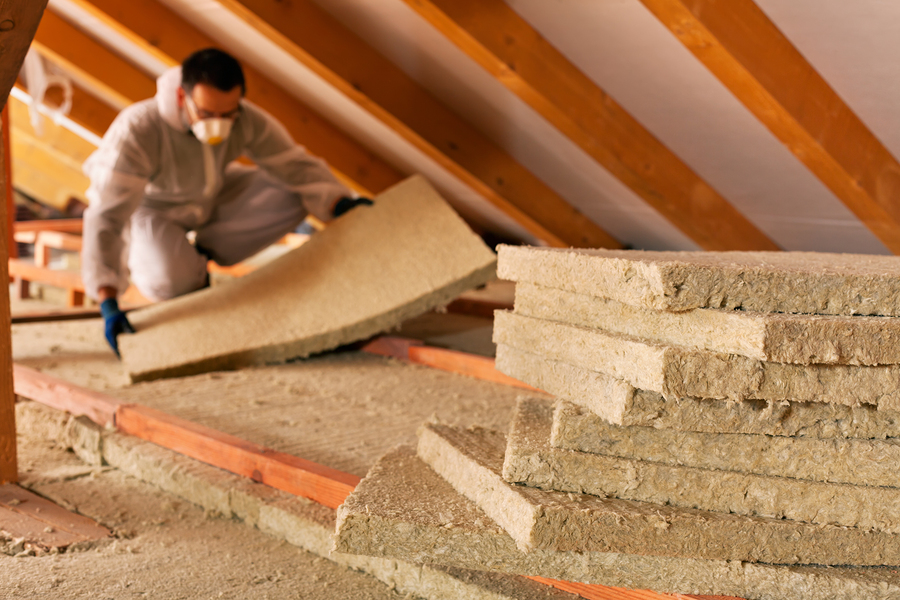 https://energyproutah.com/files/bigstock/2016/04/Man-Laying-Thermal-Insulation-77015225.jpg